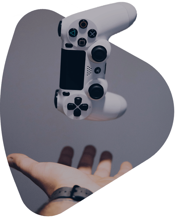 a hand throwing a Playstation 5 controller