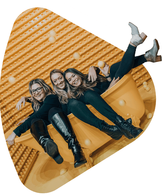 happy women in a golden bathtub